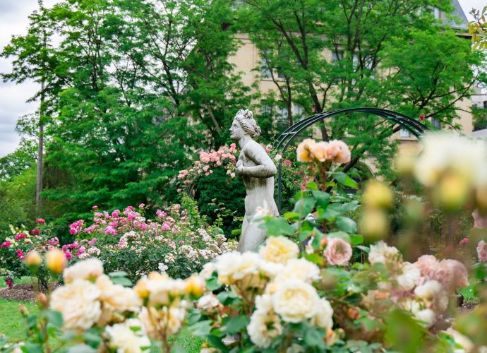 woman statue near plants and trees