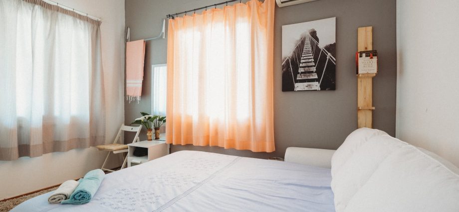 white bedspread inside room