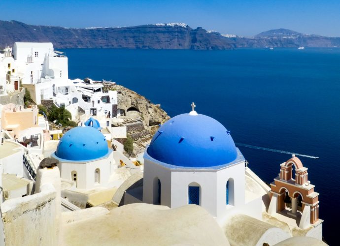 white and blue dome building near body of water during daytime