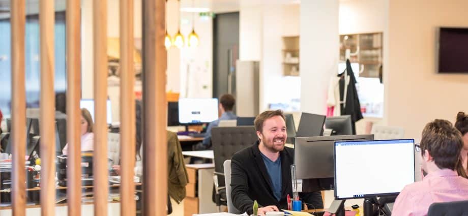 a man sitting at a desk in an office